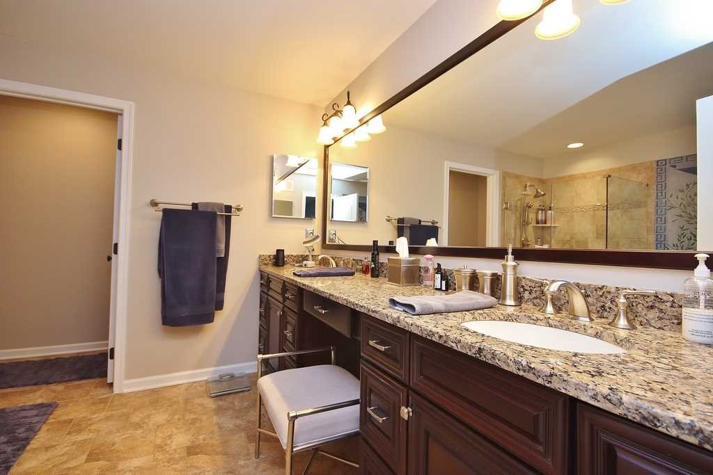 1118 Cold Spring Road Fishkill, NY 12524 - Photo 25 of 34 a bathroom with a granite countertop sink a mirror and vanity
