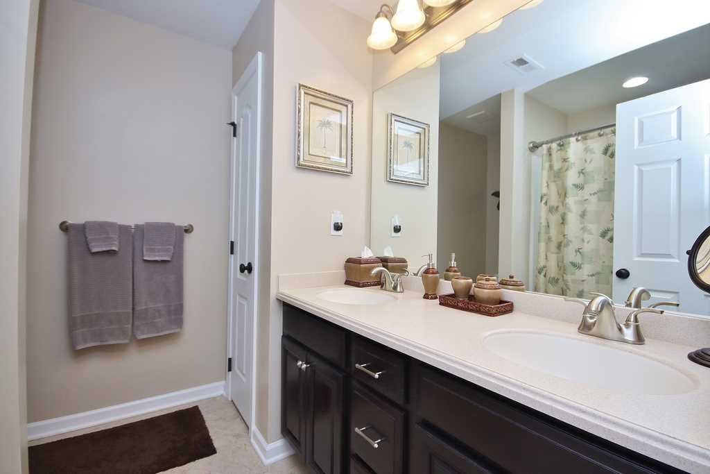 1118 Cold Spring Road Fishkill, NY 12524 - Photo 29 of 34 a bathroom with a sink double vanity and a mirror