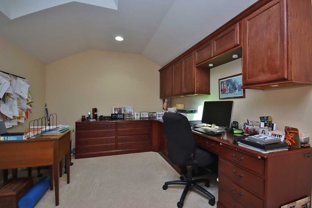 1118 Cold Spring Road Fishkill, NY 12524 - Photo 31 of 34 a room with a desk and chair with potted plants