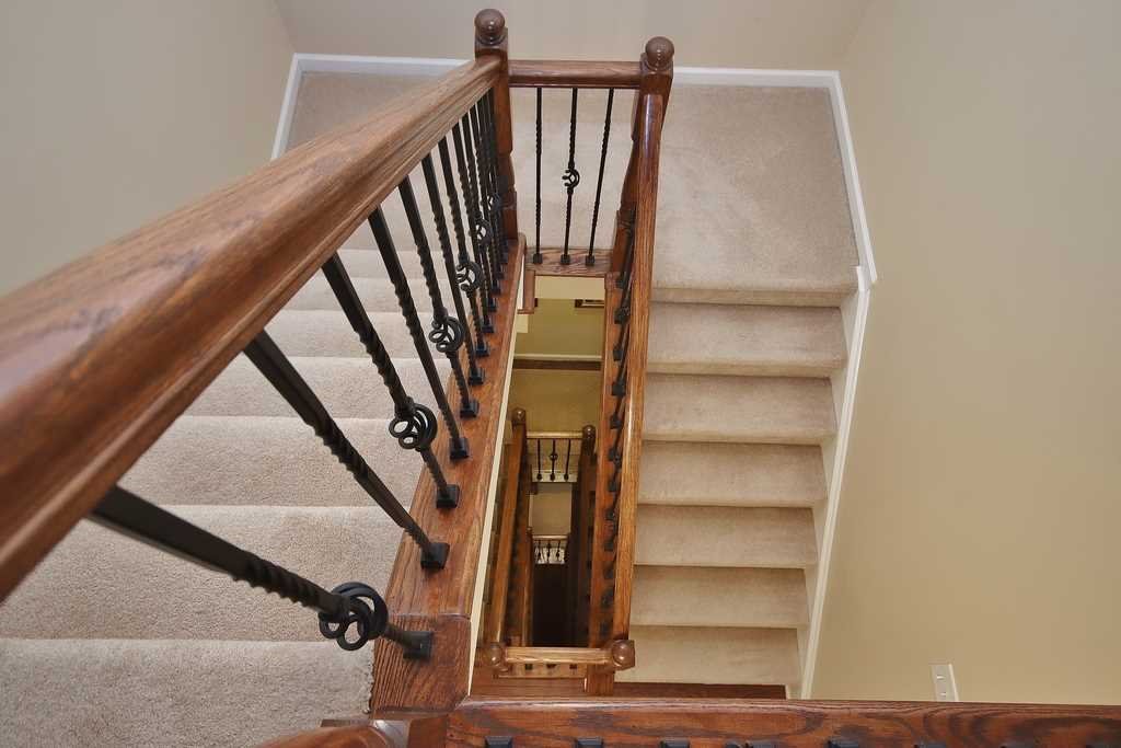 1118 Cold Spring Road Fishkill, NY 12524 - Photo 32 of 34 a view of staircase with wooden floor and chair