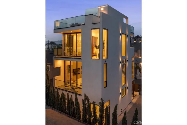 a bedroom with a bed and glass walk in closet