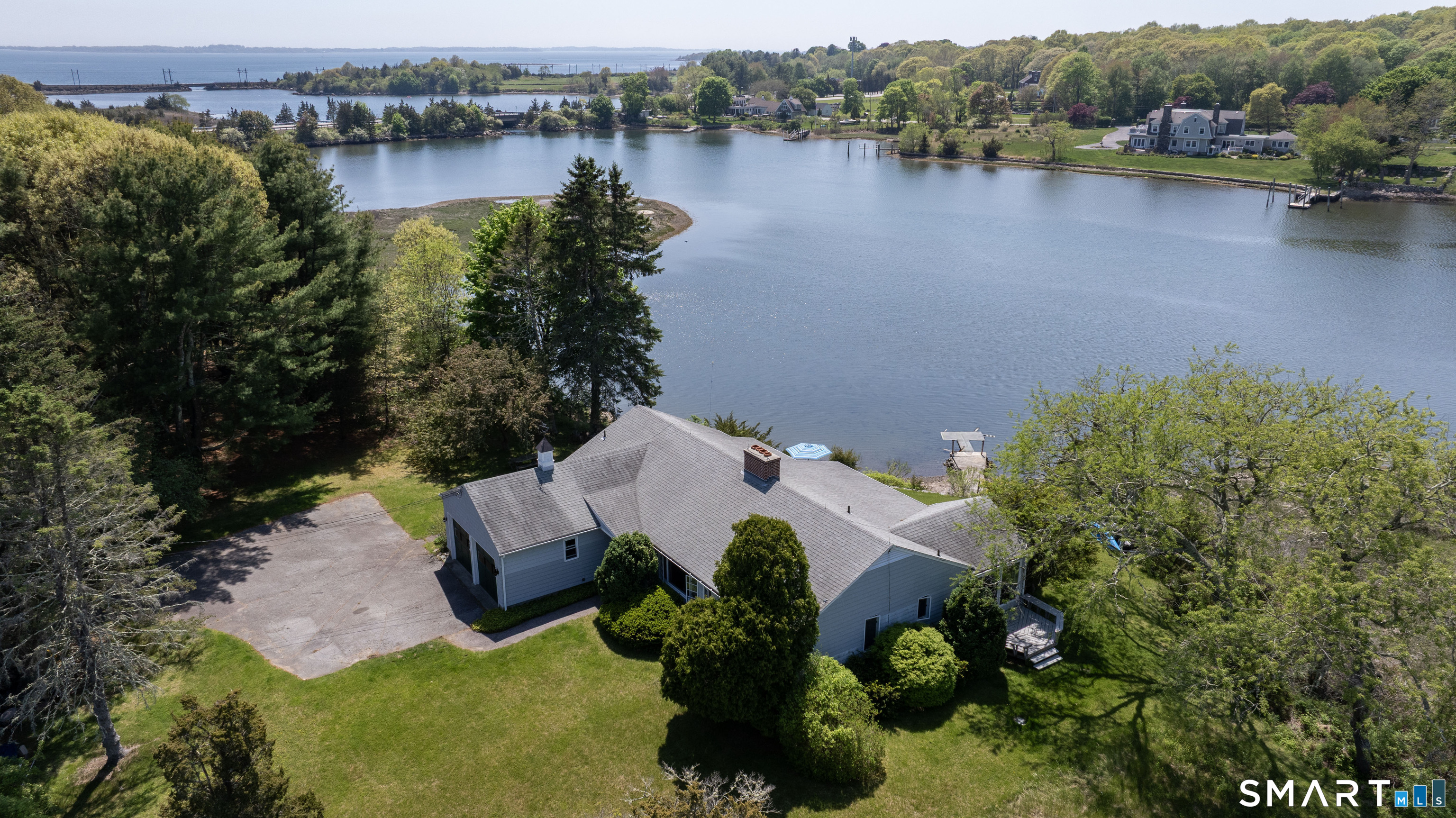 27 Wilbur Road Stonington, CT 06378 - Photo 1 of 40 an aerial view of house with yard and lake view