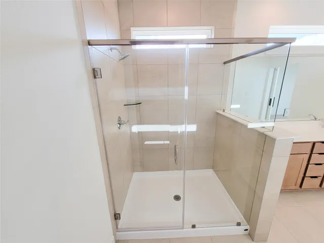 a bathroom with a tub and a shower