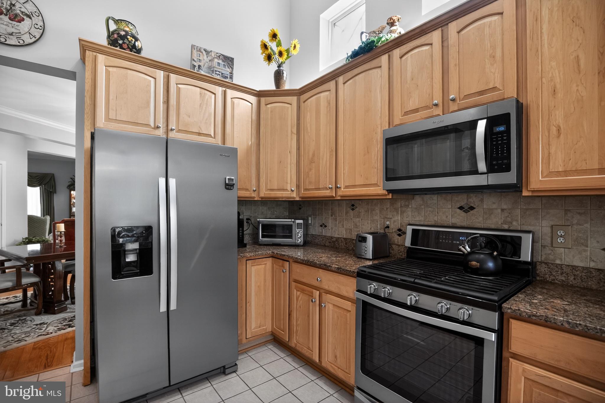 9 Simpkins Lane Pemberton, NJ 08068 - Photo 19 of 36 Modern kitchen with warm wood tones.