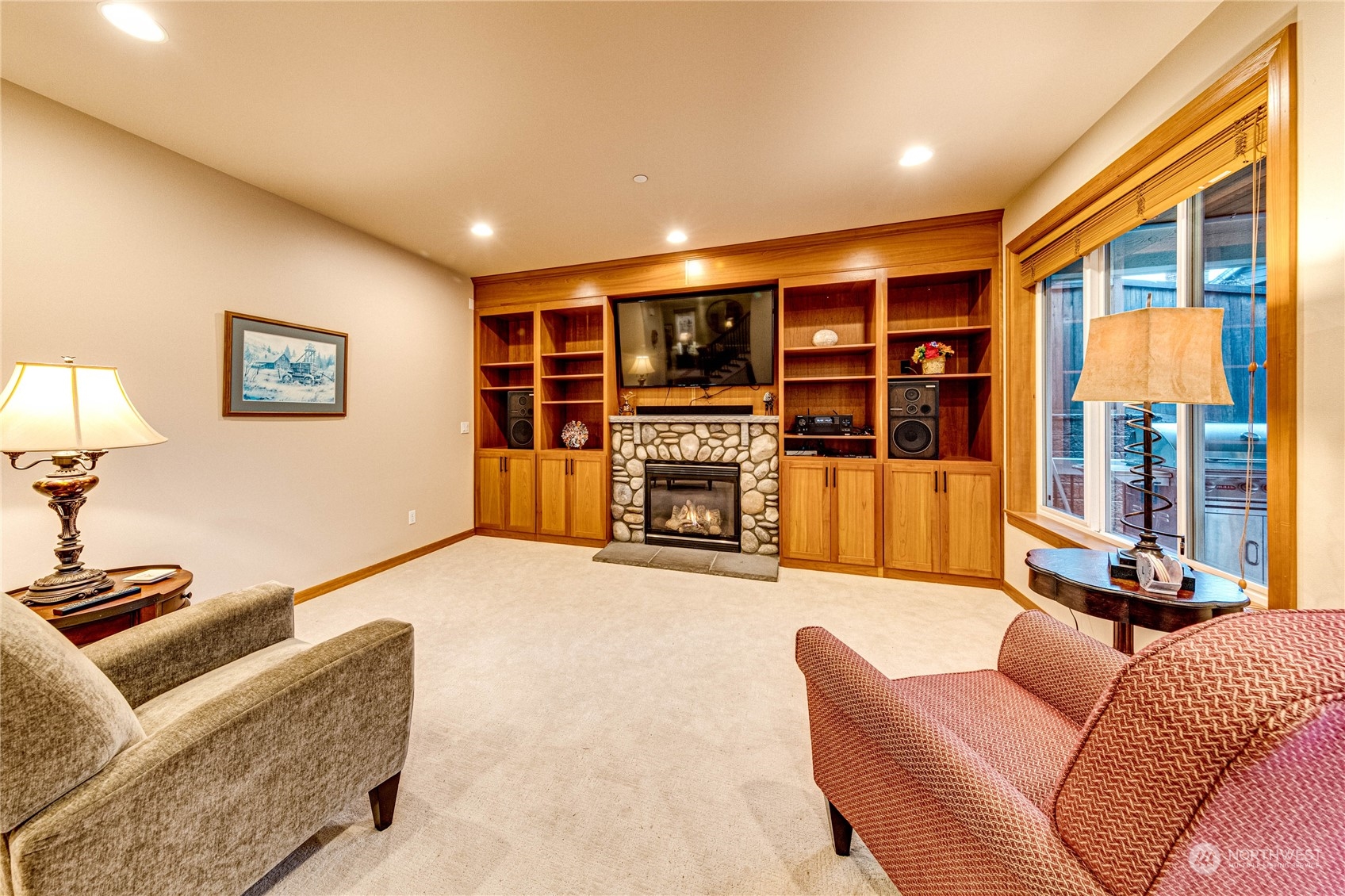 18928 108th Avenue Northeast Bothell, WA 98011 - Photo 15 of 39 a living room with furniture and a flat screen tv