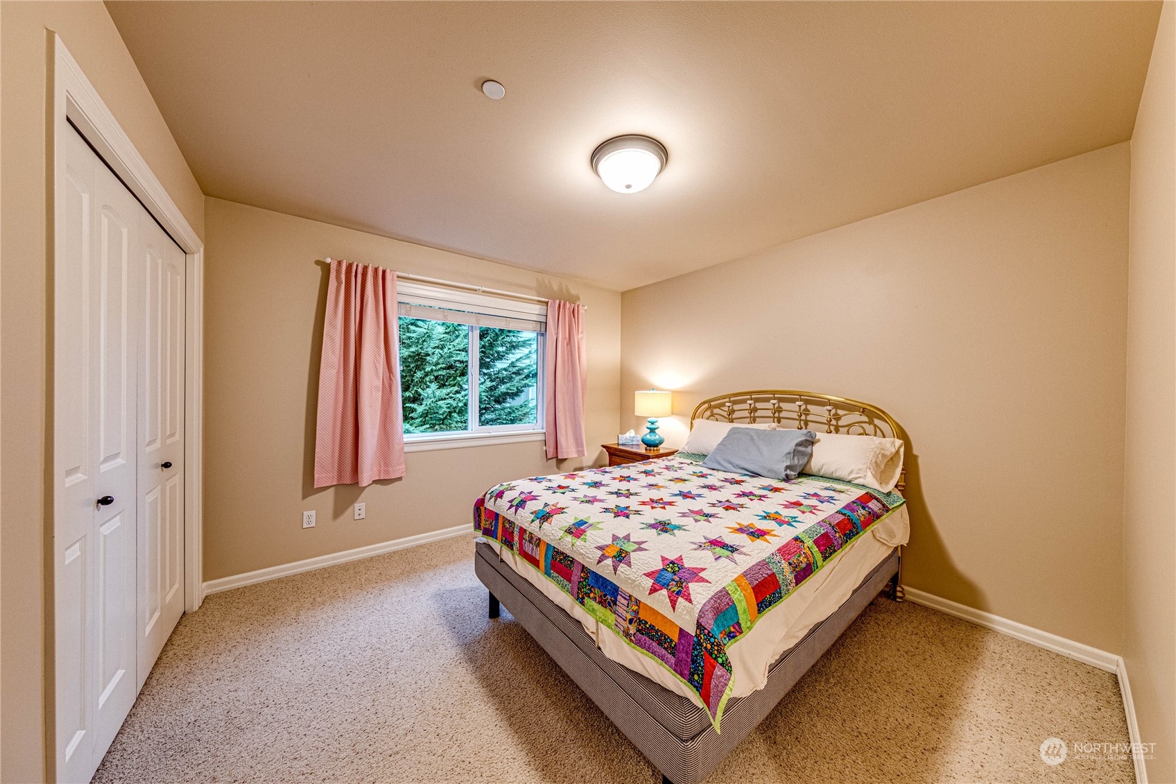 18928 108th Avenue Northeast Bothell, WA 98011 - Photo 18 of 39 a bedroom with a bed lamp and window