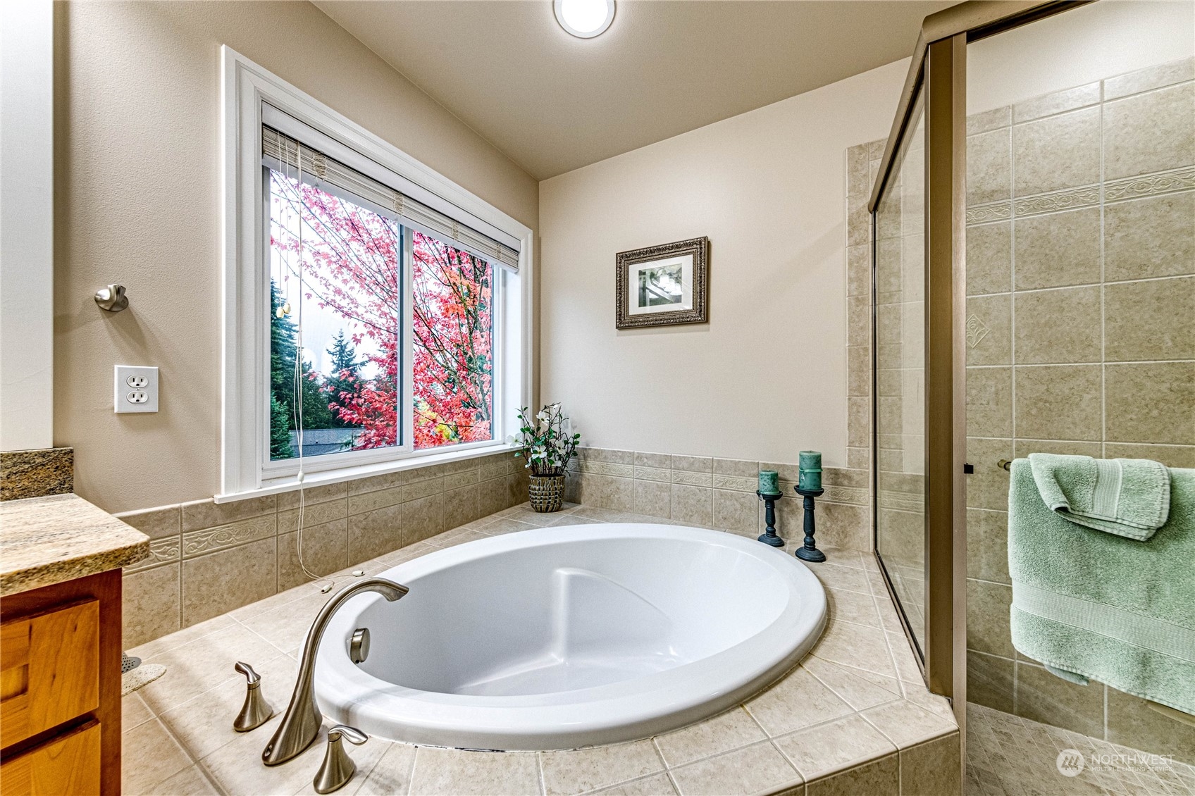 18928 108th Avenue Northeast Bothell, WA 98011 - Photo 26 of 39 a bathroom with a tub sink and mirror