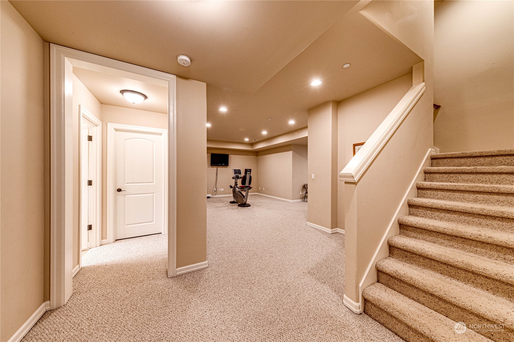 18928 108th Avenue Northeast Bothell, WA 98011 - Photo 27 of 39 a view of a hallway with a livingroom and a hall with wooden floor