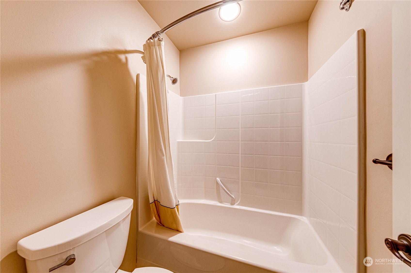 18928 108th Avenue Northeast Bothell, WA 98011 - Photo 33 of 39 a bathroom with a bathtub and a shower