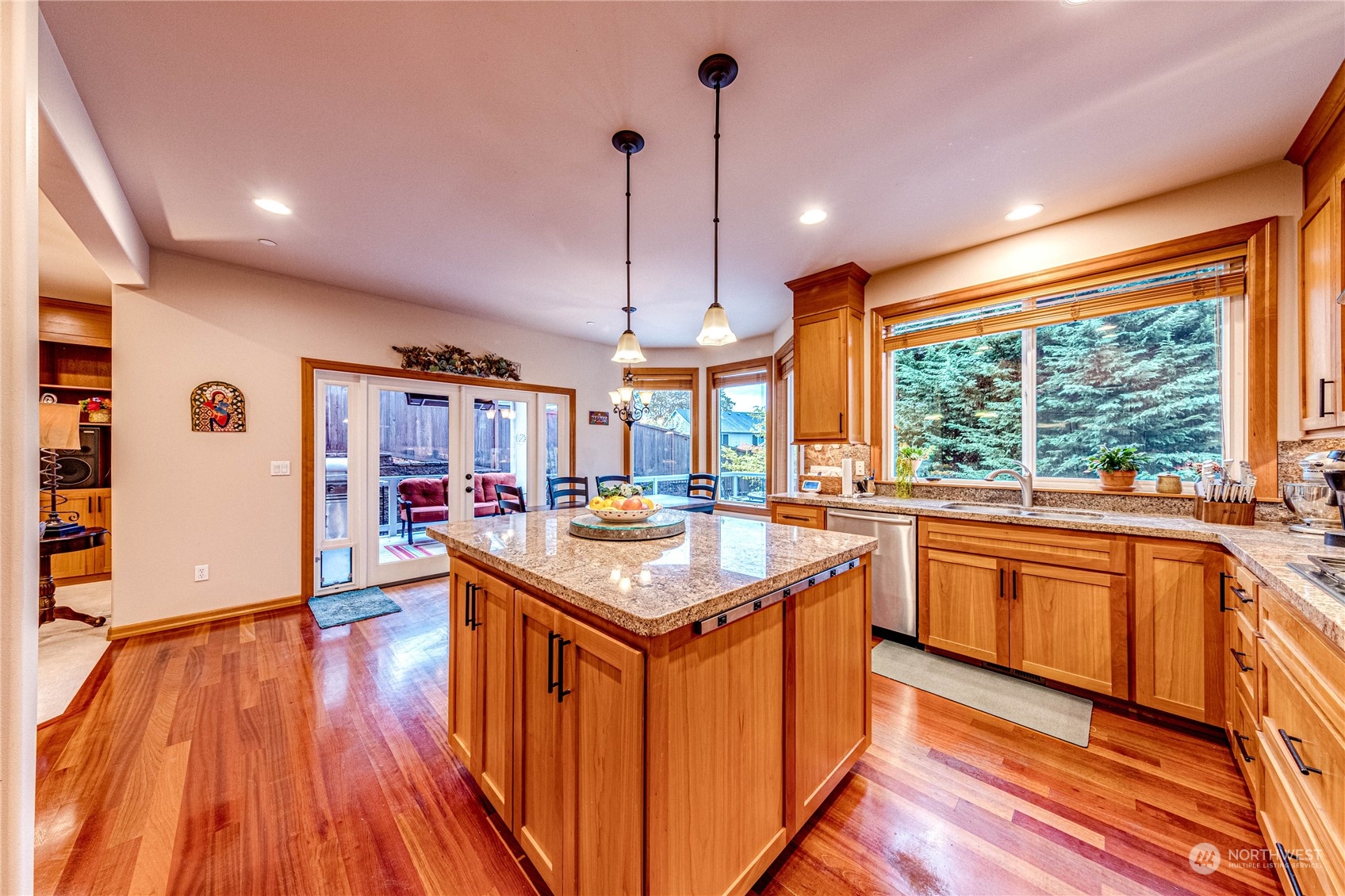18928 108th Avenue Northeast Bothell, WA 98011 - Photo 10 of 39 a kitchen with stainless steel appliances granite countertop a stove and a wooden floors
