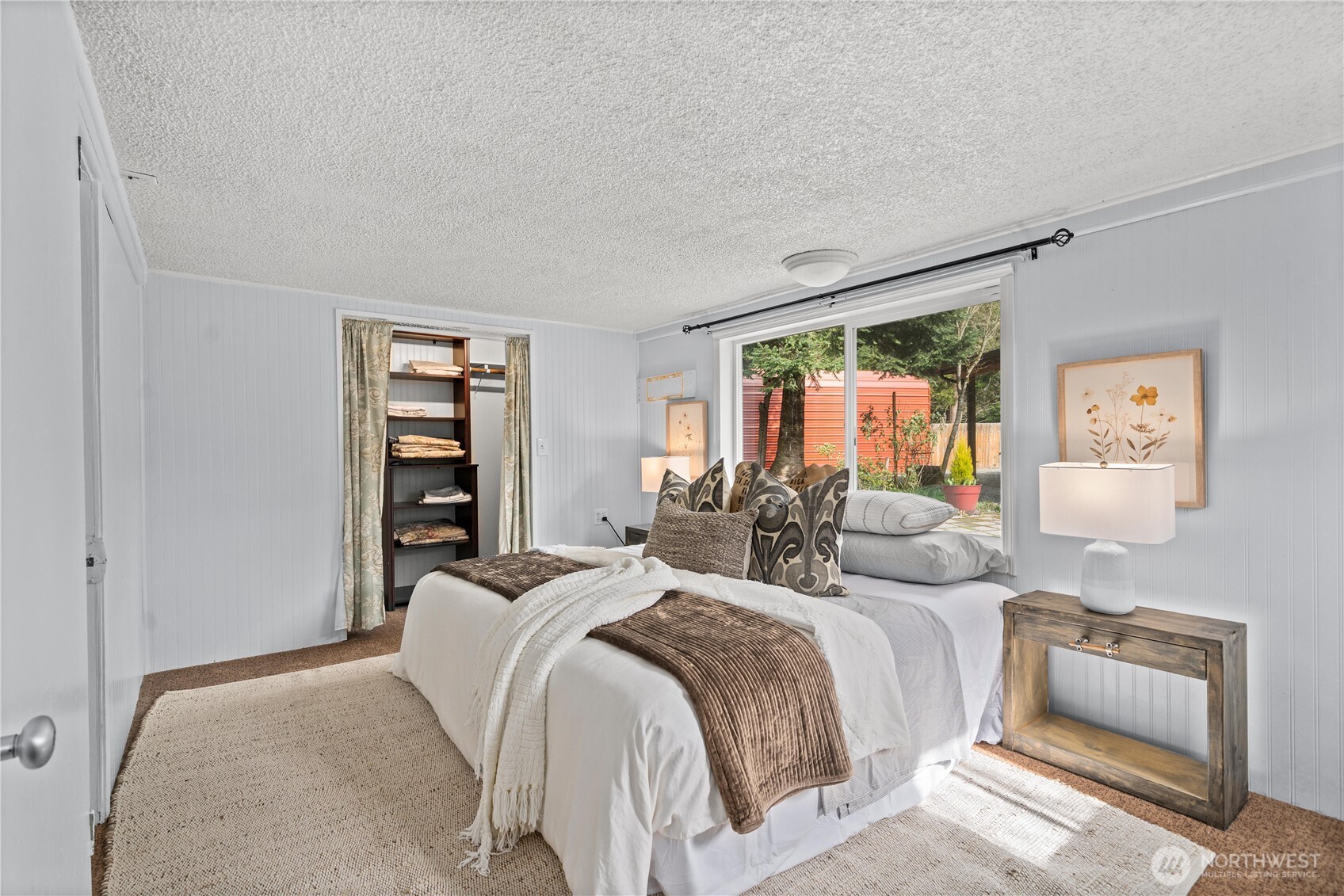 23711 Dorre Don Way Southeast Maple Valley, WA 98038 - Photo 21 of 40 a bedroom with a bed and a couch