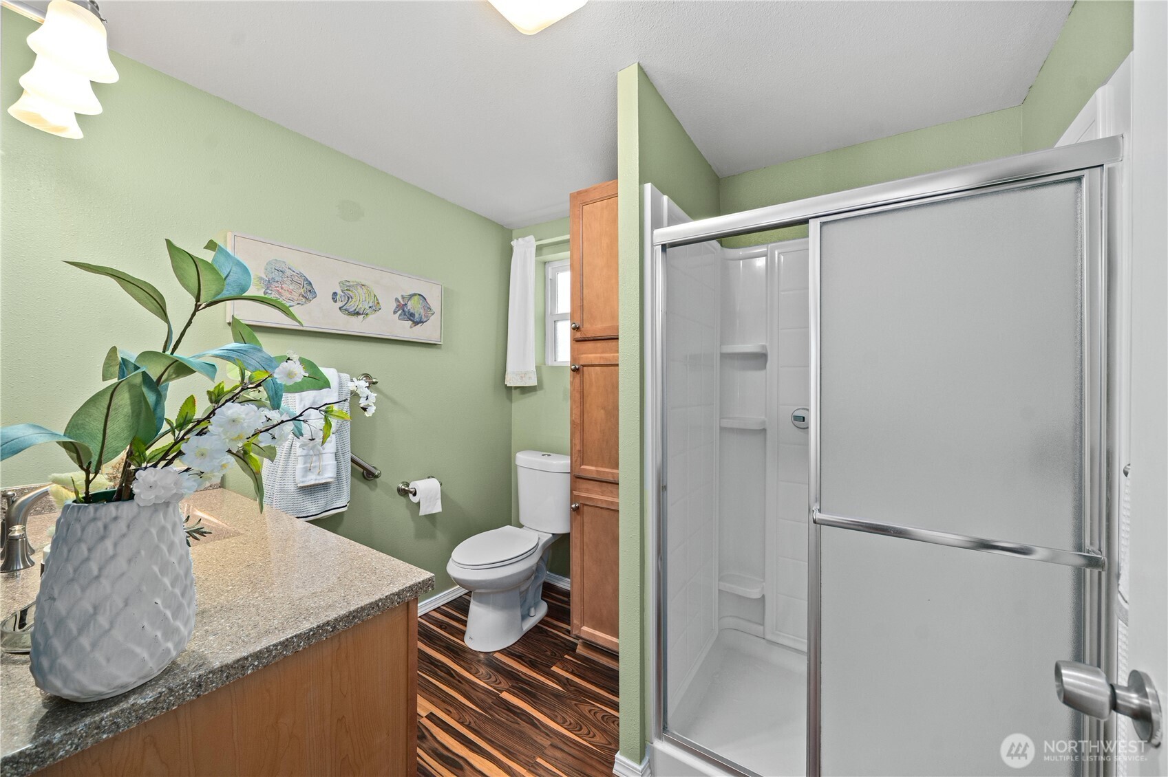 23711 Dorre Don Way Southeast Maple Valley, WA 98038 - Photo 23 of 40 a bathroom with a granite countertop sink a toilet and shower