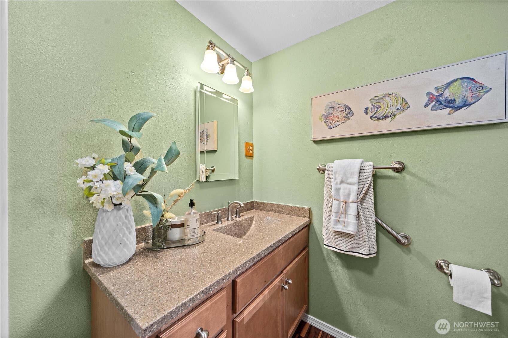 23711 Dorre Don Way Southeast Maple Valley, WA 98038 - Photo 24 of 40 a bathroom with a granite countertop sink a toilet and a mirror