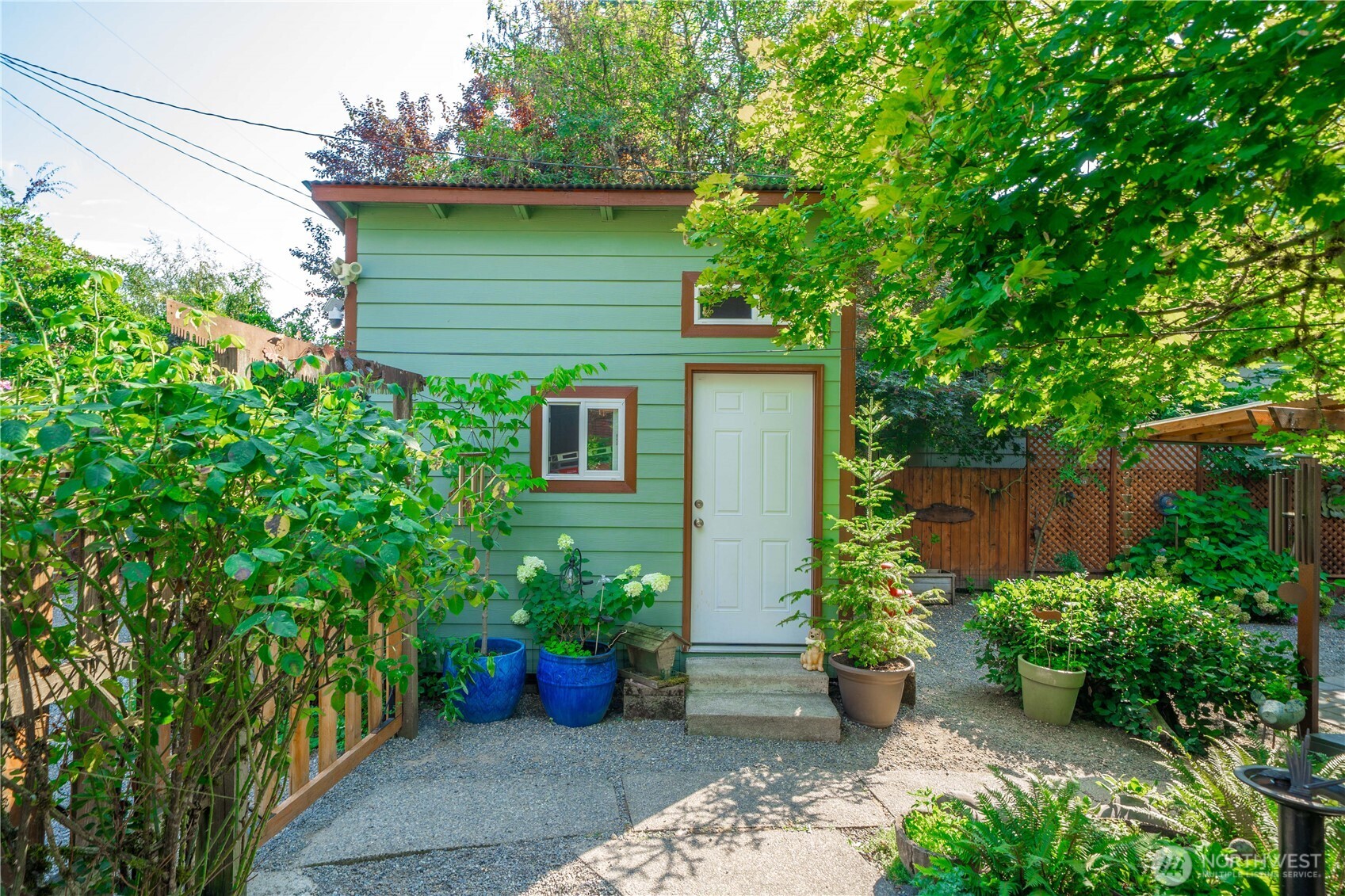 23711 Dorre Don Way Southeast Maple Valley, WA 98038 - Photo 27 of 40 a view of a backyard with potted plants and large trees