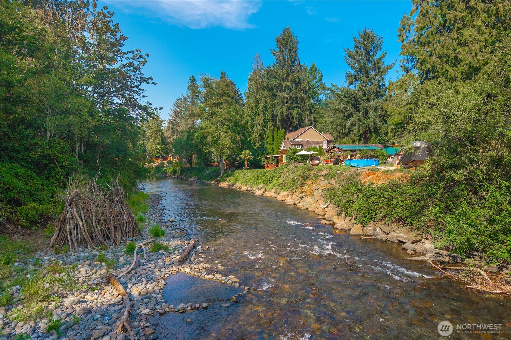 23711 Dorre Don Way Southeast Maple Valley, WA 98038 - Photo 37 of 40 a backyard of a house with a yard and outdoor seating