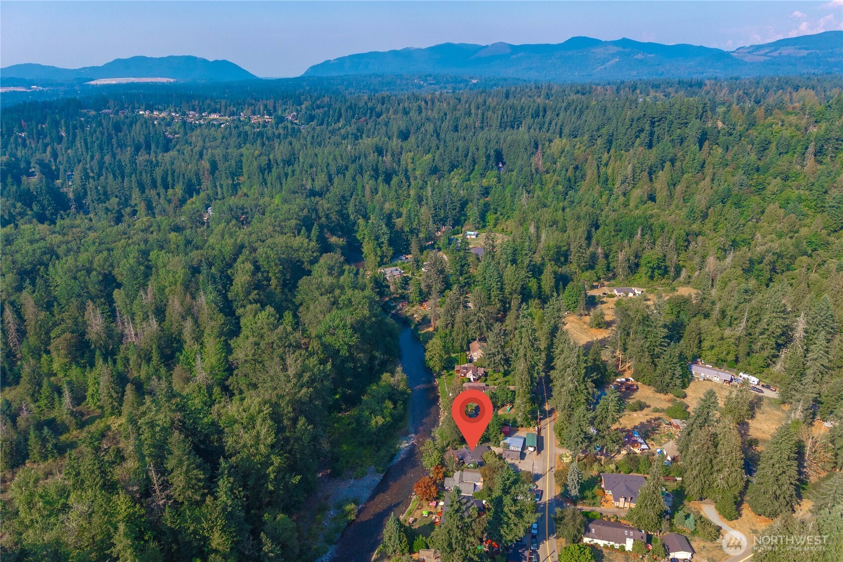 23711 Dorre Don Way Southeast Maple Valley, WA 98038 - Photo 40 of 40 a view of a lush green hillside and a building