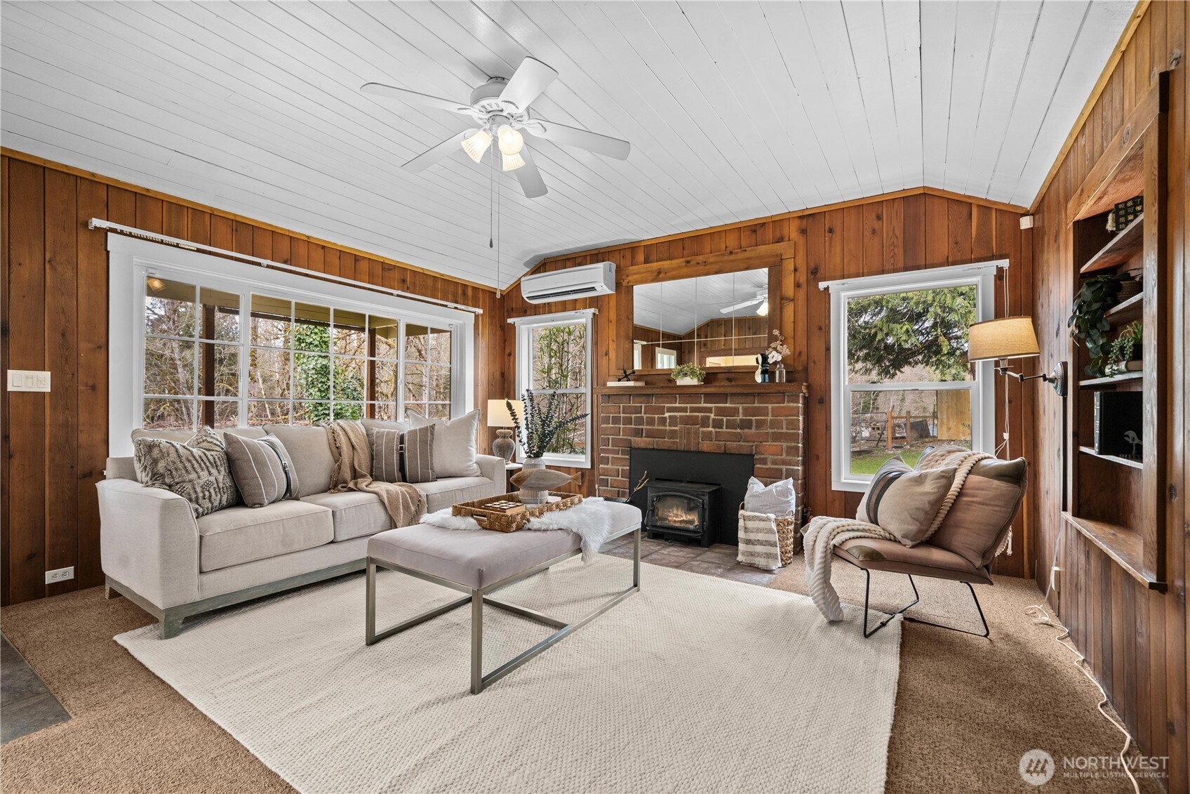 23711 Dorre Don Way Southeast Maple Valley, WA 98038 - Photo 6 of 40 a living room with furniture and a fireplace