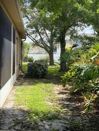 a backyard of a house with lots of green space