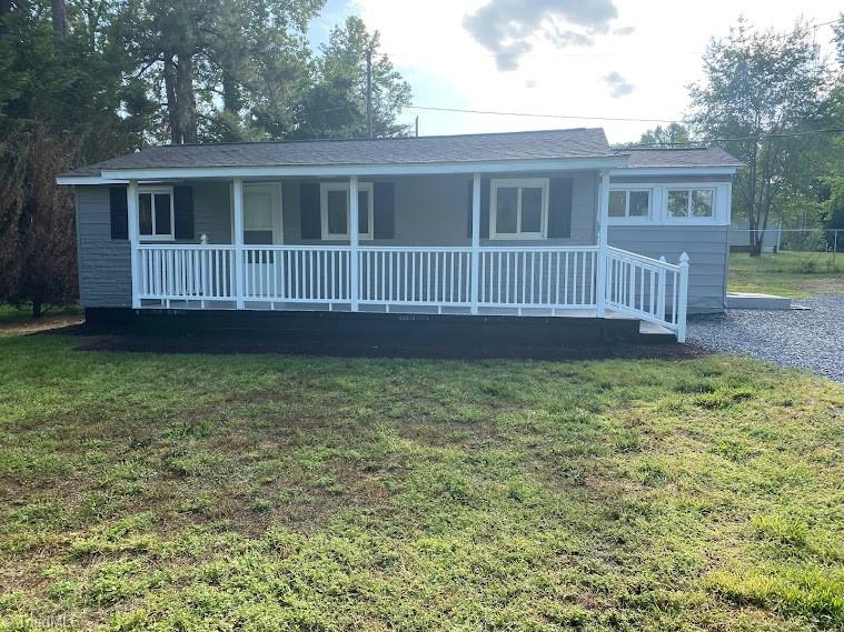 7703 Jackson School Road Browns Summit, NC 27214 - Photo 2 of 14 Exterior has new paint and new Vinyl Rails on Front Porch