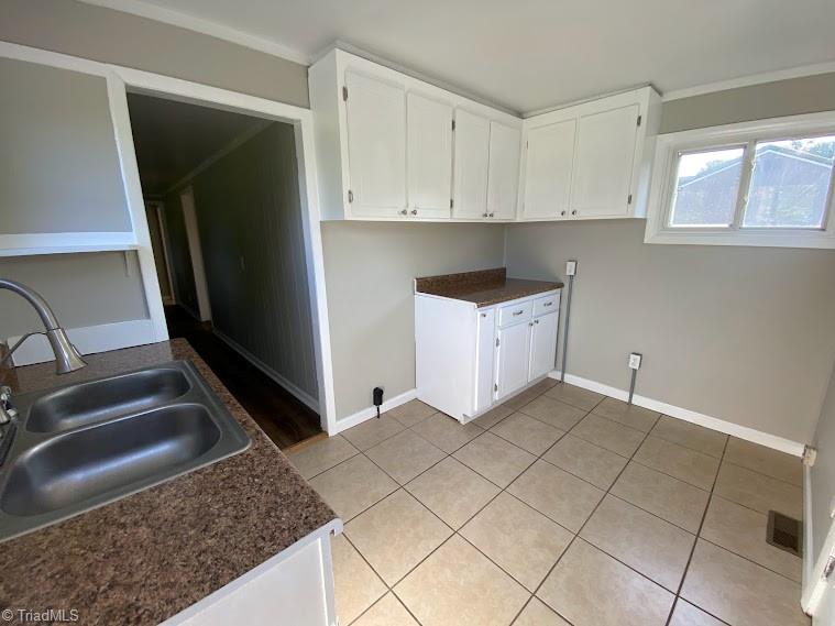 7703 Jackson School Road Browns Summit, NC 27214 - Photo 4 of 14 Kitchen has tile floor