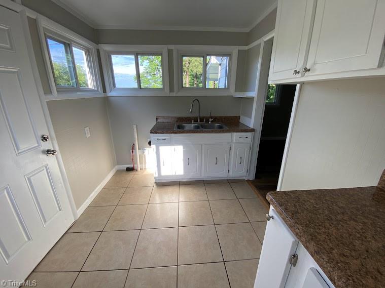 7703 Jackson School Road Browns Summit, NC 27214 - Photo 6 of 14 Stackable washer dryer hookups in kitchen