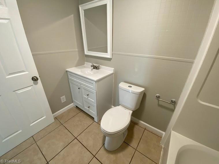 7703 Jackson School Road Browns Summit, NC 27214 - Photo 8 of 14 New vanity, mirror, faucet, and toilet