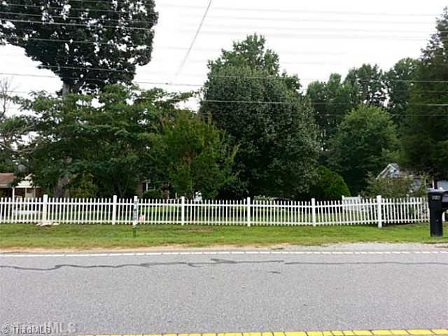 Exterior Front. White vinyl fence in front yard. Installed 2 years ago.