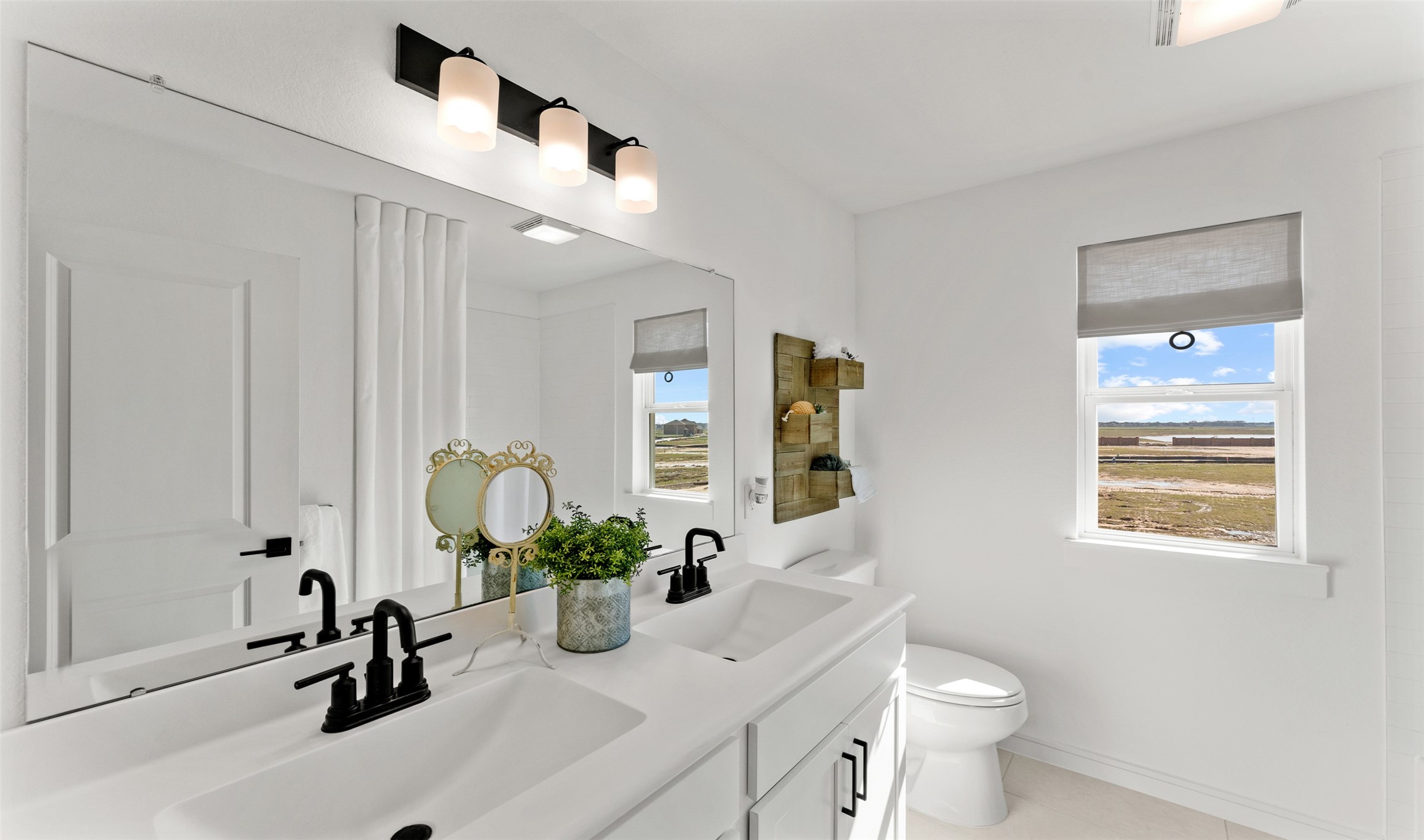2818 Duchess Drive Rosenberg, TX 77471 - Photo 18 of 30 a bathroom with a sink a toilet and a mirror