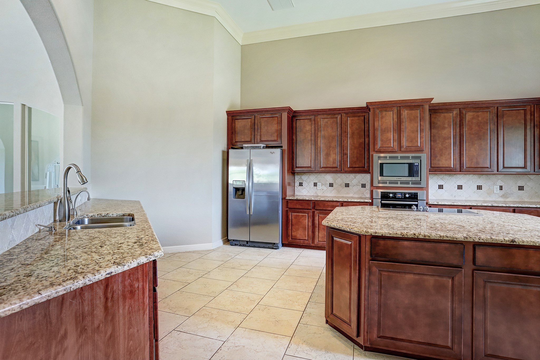 2818 Duchess Drive Rosenberg, TX 77471 - Photo 25 of 30 a kitchen with stainless steel appliances granite countertop a sink stove and refrigerator