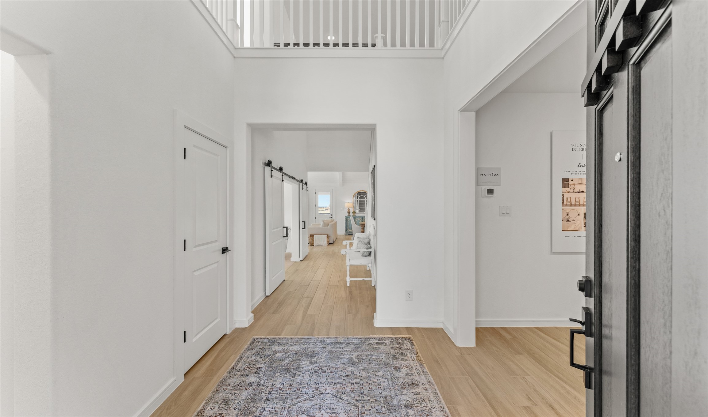 2818 Duchess Drive Rosenberg, TX 77471 - Photo 3 of 30 a view of a hallway with wooden floor and staircase