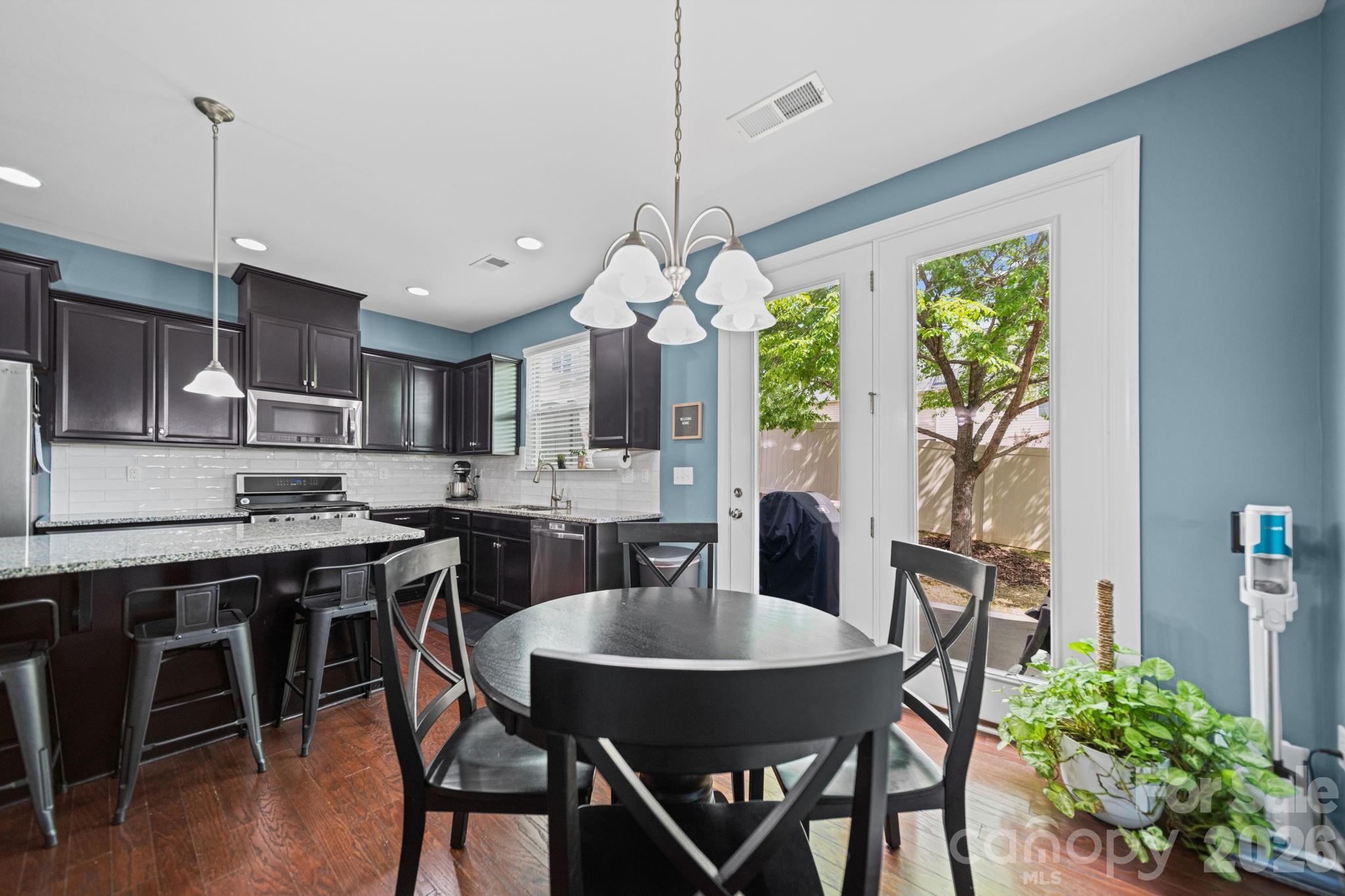 1108 Roderick Drive Fort Mill, SC 29708 - Photo 14 of 39 a view of a dining room with furniture window and wooden floor