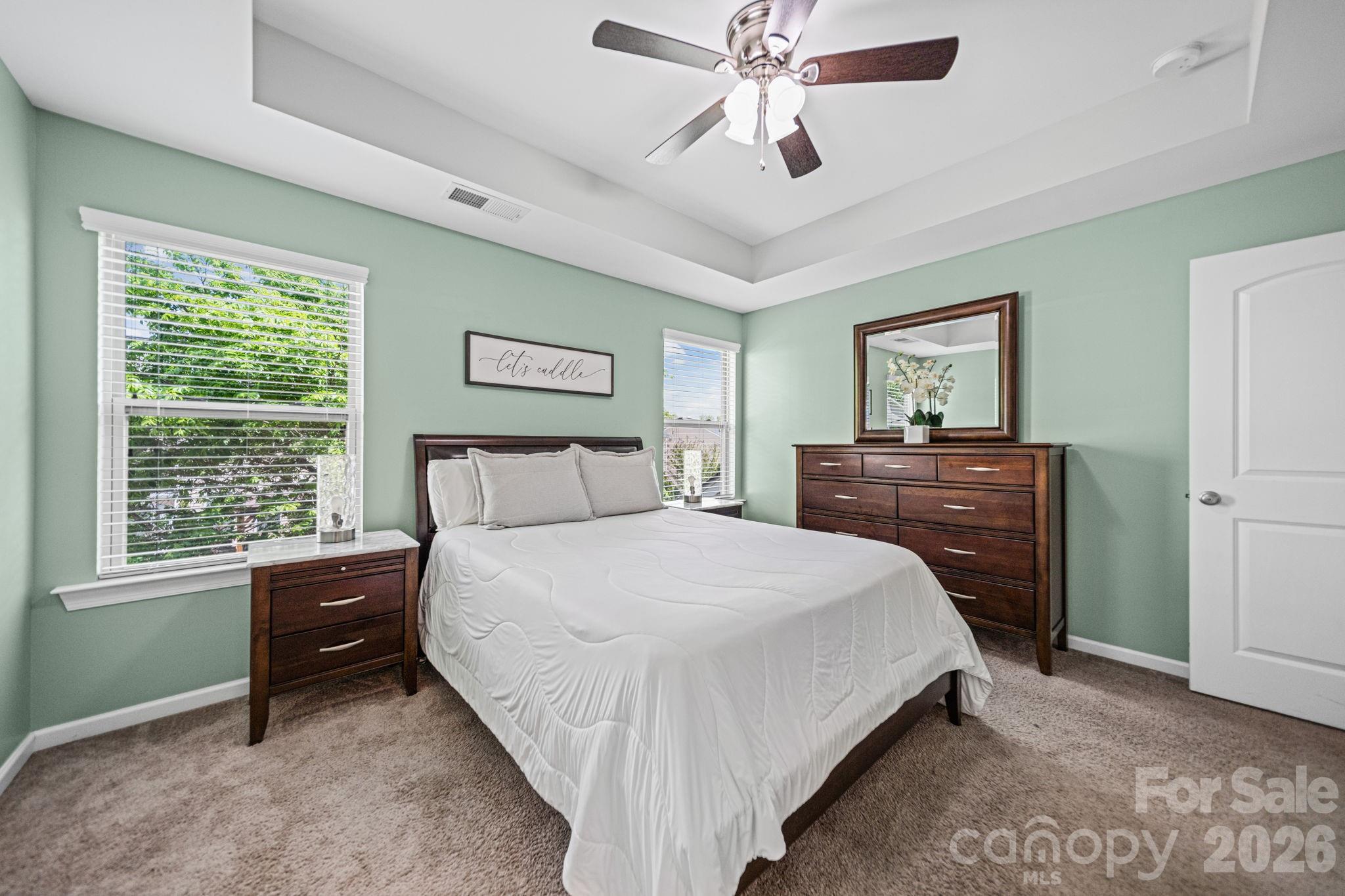 1108 Roderick Drive Fort Mill, SC 29708 - Photo 19 of 39 a bedroom with a bed and a chandelier