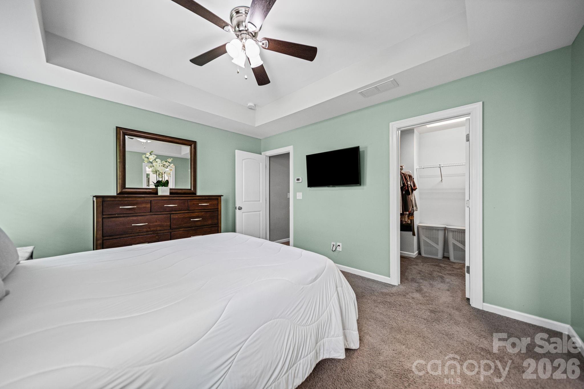 1108 Roderick Drive Fort Mill, SC 29708 - Photo 20 of 39 a bedroom with a bed and a flat tv screen on dresser