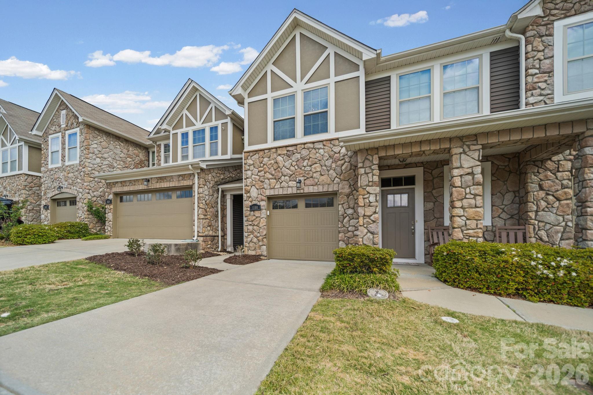 1108 Roderick Drive Fort Mill, SC 29708 - Photo 2 of 39 a front view of a house with a yard and garage