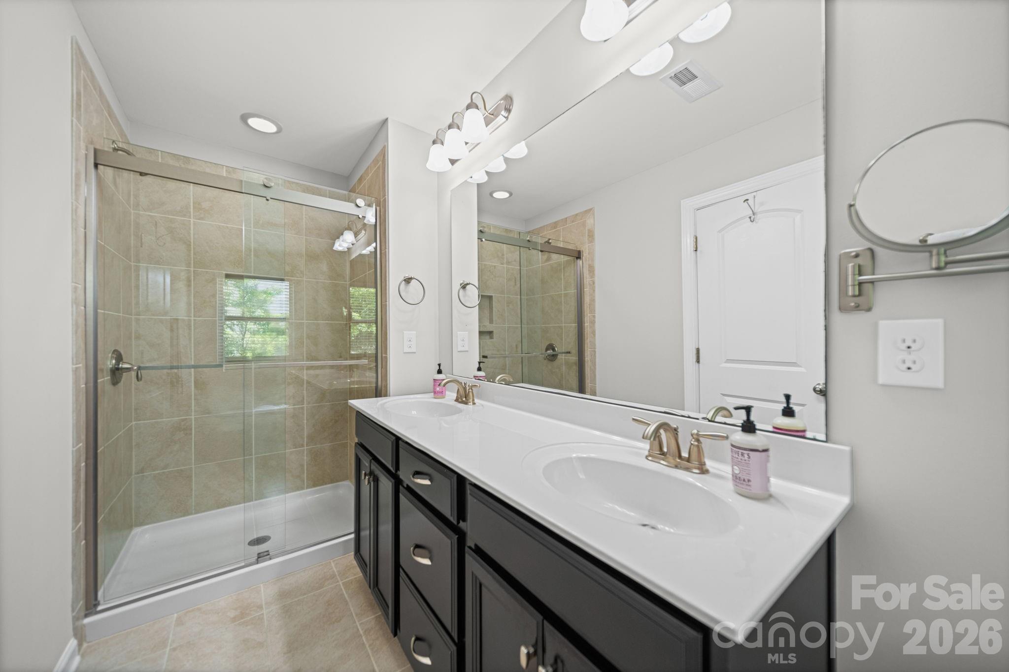 1108 Roderick Drive Fort Mill, SC 29708 - Photo 21 of 39 a bathroom with a sink a toilet a mirror and shower