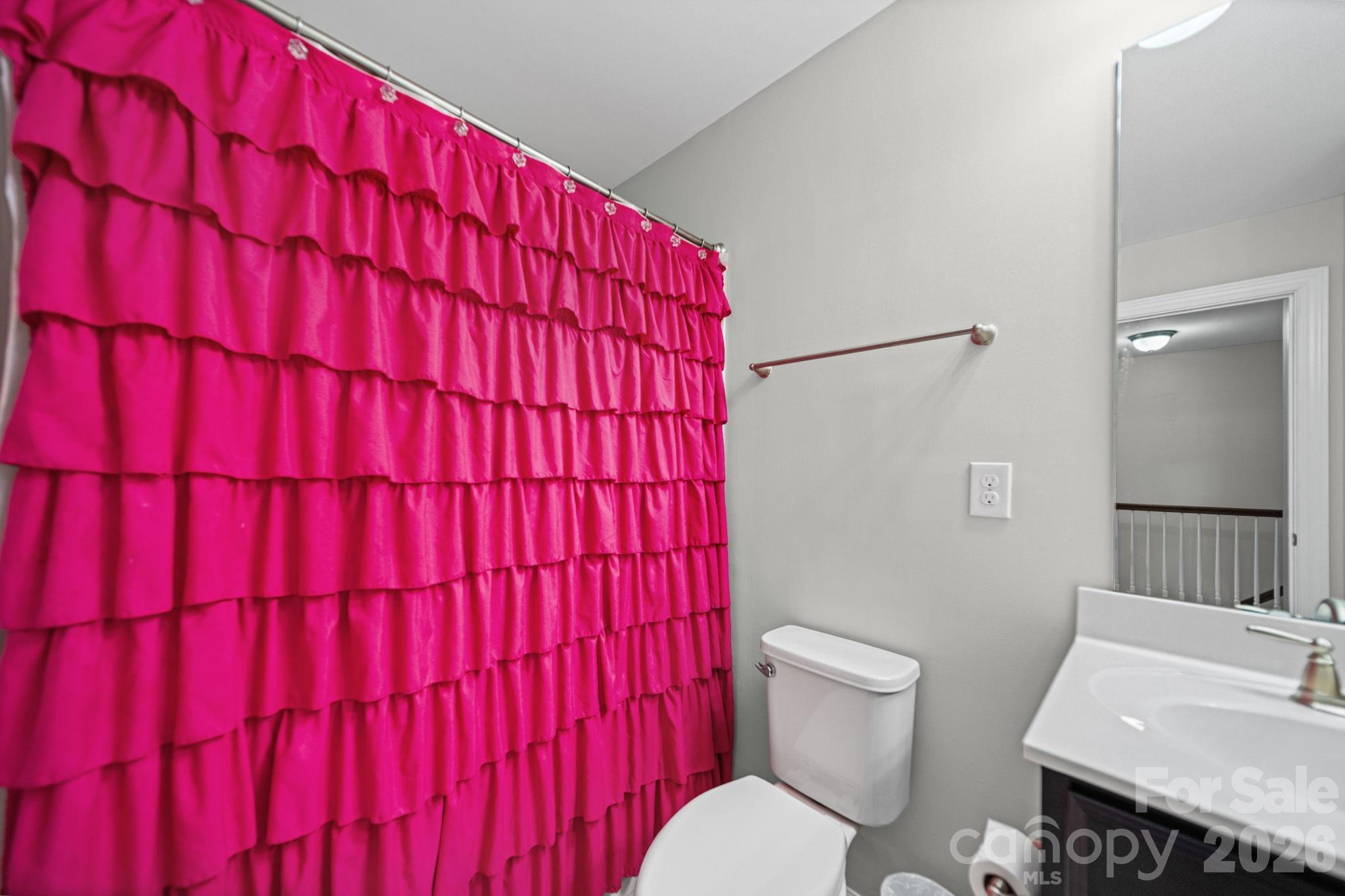 1108 Roderick Drive Fort Mill, SC 29708 - Photo 27 of 39 a bathroom with a toilet a sink and a mirror