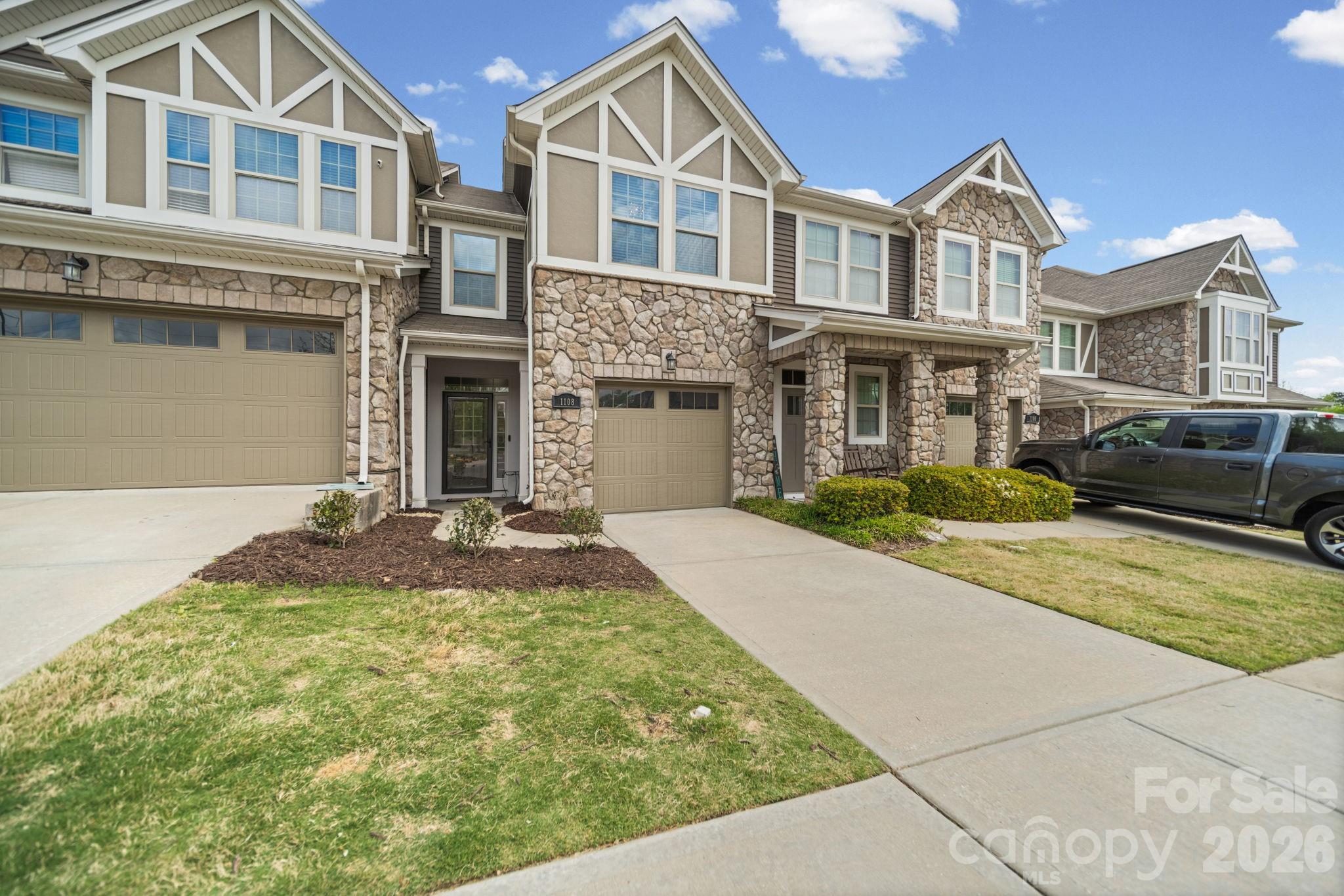 1108 Roderick Drive Fort Mill, SC 29708 - Photo 3 of 39 a front view of a house with a yard