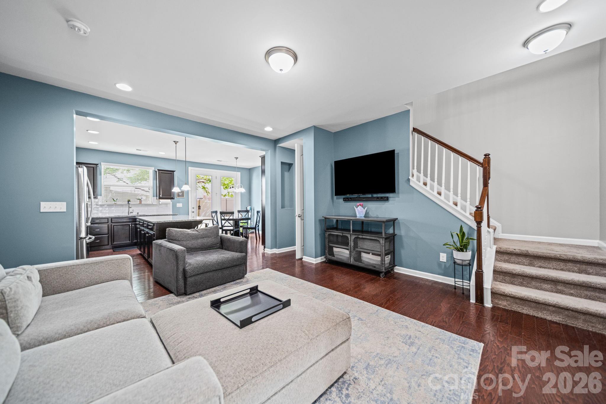 1108 Roderick Drive Fort Mill, SC 29708 - Photo 4 of 39 a living room with furniture and a flat screen tv with wooden floor