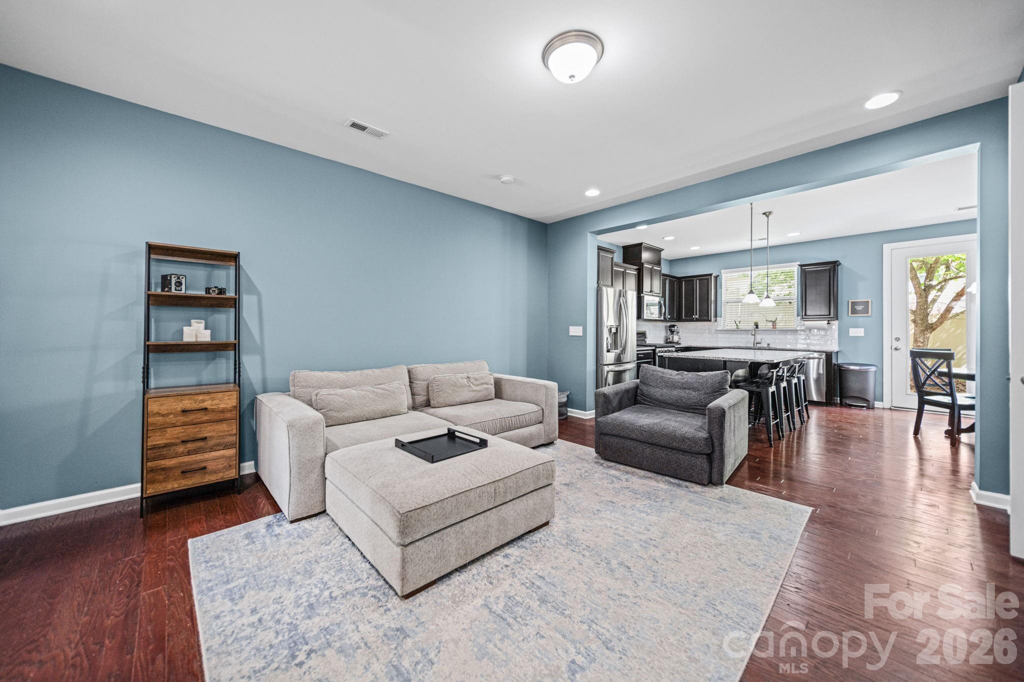 1108 Roderick Drive Fort Mill, SC 29708 - Photo 5 of 39 a living room with furniture and a dining table with wooden floor