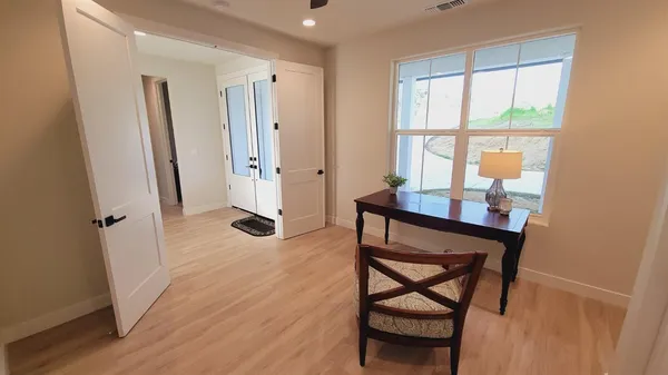 a view of a dining room with furniture window and wooden floor