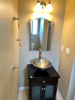 18-7856 Kaniela Road Mountain View, HI 96771 - Photo 13 of 30 a bathroom with a sink and a mirror