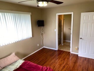 18-7856 Kaniela Road Mountain View, HI 96771 - Photo 16 of 30 a view of empty room with wooden floor and fan