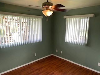 18-7856 Kaniela Road Mountain View, HI 96771 - Photo 21 of 30 a view of an empty room with wooden floor and a window