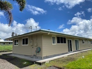 18-7856 Kaniela Road Mountain View, HI 96771 - Photo 28 of 30 a front view of a house with plants