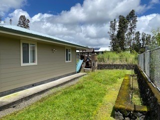 18-7856 Kaniela Road Mountain View, HI 96771 - Photo 29 of 30 a front view of a house with a yard