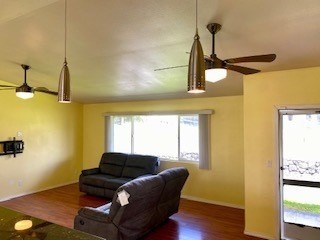18-7856 Kaniela Road Mountain View, HI 96771 - Photo 6 of 30 a living room with a couch and wooden floor