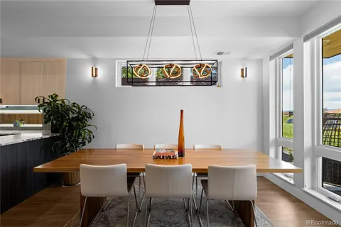 a dining room with a table and chairs