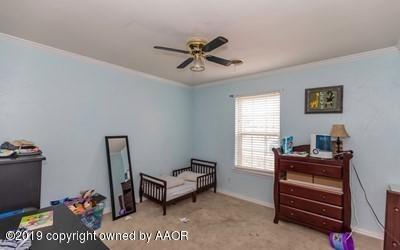 5211 South Milam Street Amarillo, TX 79110 - Photo 14 of 31 a view of a workspace with furniture and a window