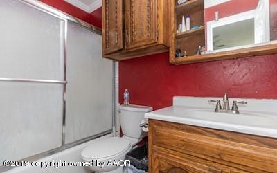 5211 South Milam Street Amarillo, TX 79110 - Photo 22 of 31 a bathroom with a sink and a mirror