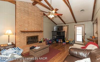 5211 South Milam Street Amarillo, TX 79110 - Photo 5 of 31 a living room with furniture and a fireplace